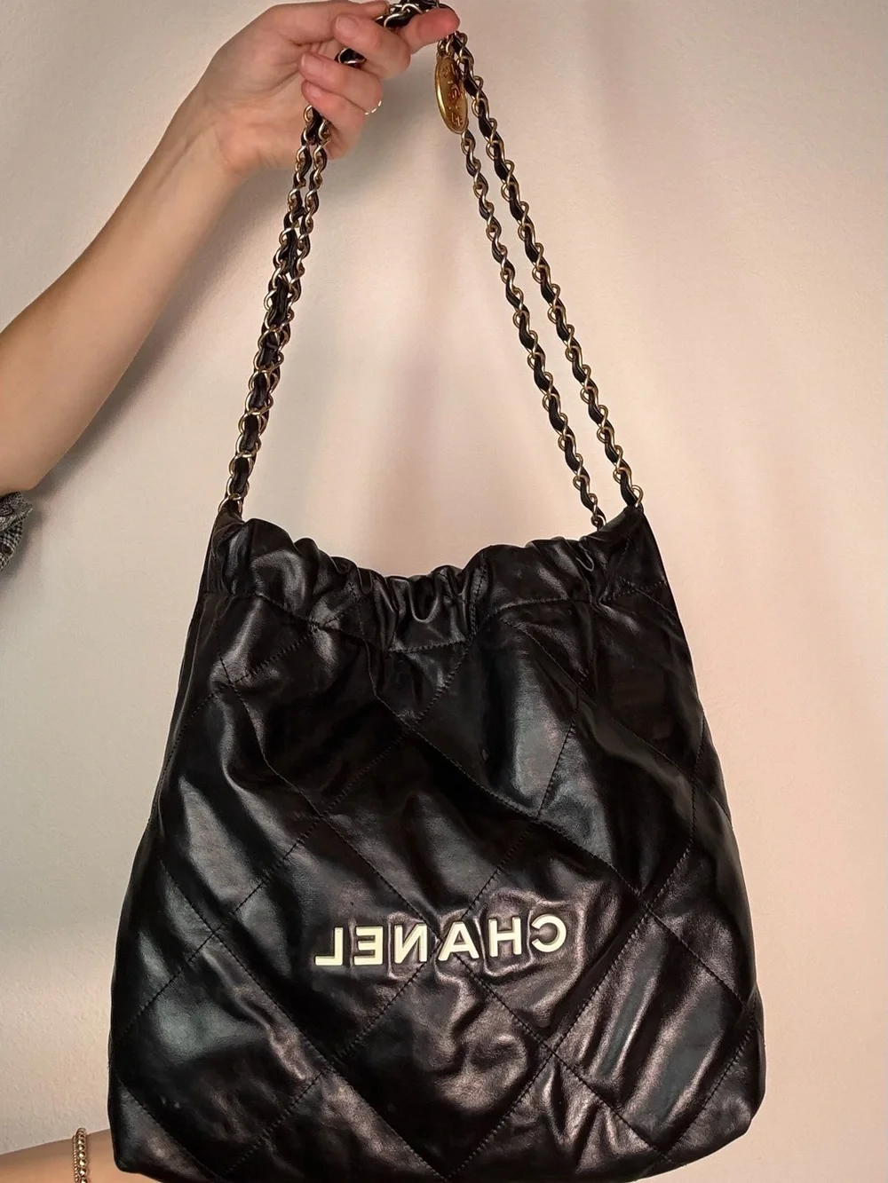 CHANEL 22 Black Quilted Leather Hobo Bag with Gold Chain and CC Medallion